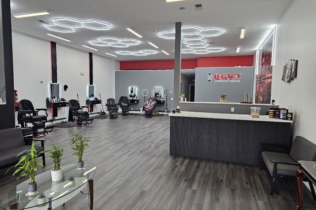 Inside Legacy Barbershop & Lounge in Plano, IL — barber stations, honeycomb lighting and the lounge